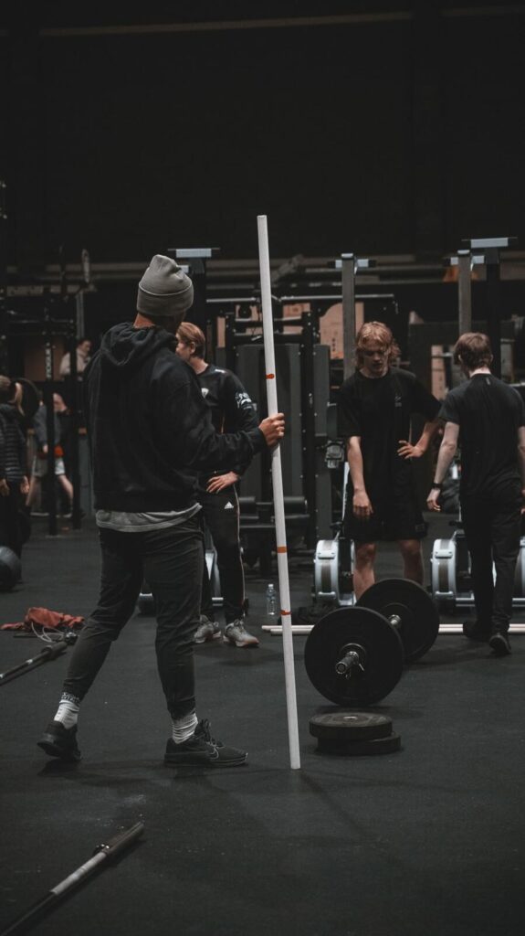 A CrossFit coach explaining how to improve athletic performance in manchester